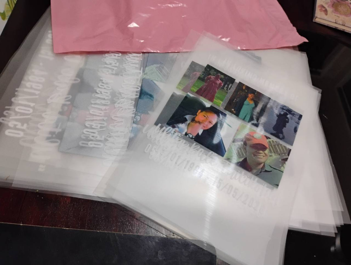 Stacked print transfer sheets featuring photo collages and personalised white lettering.